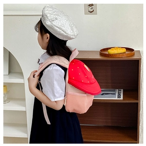 Pink and red kindergarten backpack with star patterns and a side mesh pocket for kids