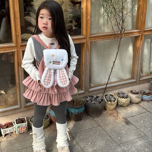 Cute plush rabbit backpack for kids with pink checkered ears and soft white faux fur