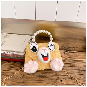 Detail of plush cat handbag featuring pearl handle and golden chain shoulder strap