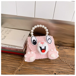 Close-up of pink plush bunny bag with faux pearl handle and gold chain strap details