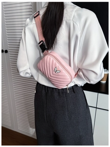 Pink quilted PU leather kids chest bag with white butterfly logo shown on model's back