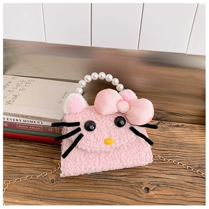 Close-up of pink plush kitten bag with pearl handle and golden chain details