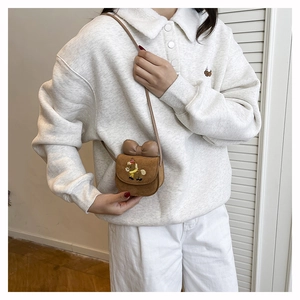 Mini brown suede crossbody bag for girls with cute cartoon pony and leather bow detail