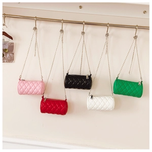Quilted cylinder bags with chain straps in five colors including pink, white, and green