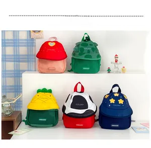Close-up of cute cartoon fruit-themed mini backpacks with unique sun hat shaped flaps