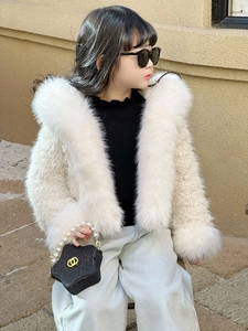 Detail of white faux fur jacket for girls with rich plush trim and pearl handle star bag