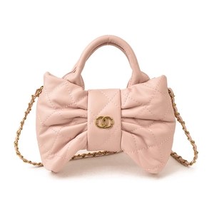 Pink bow-shaped quilted girls handbag with gold chain strap and dual carry handles