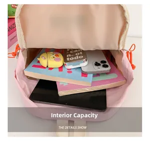 Internal view of pink school backpack showing large capacity for books and tablet