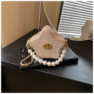 Star-shaped champagne glitter mini bag with pearl handle and golden metal logo detail