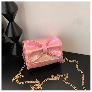 Detail of pink laser leather crossbody bag with quilted pattern and large bow decoration