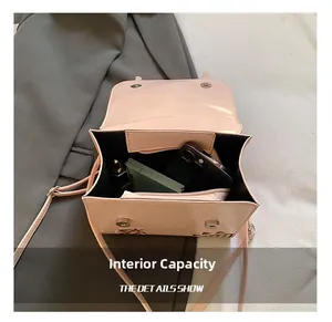 Internal capacity of the pink crossbody bag showing space for phone and makeup