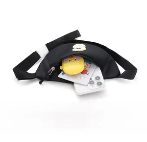 Internal view of black nylon chest bag showing storage for phone and accessories