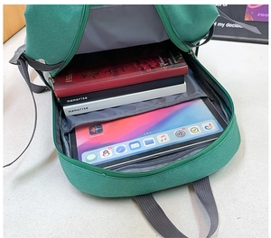 Interior view of large capacity kids backpack showing laptop sleeve and storage space