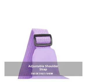 Detail view of adjustable purple nylon shoulder strap with durable black plastic buckle
