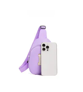 Size comparison of light purple kids' chest bag with 'H' patch next to a smartphone
