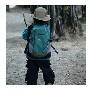 Kids outdoor backpack in green color block with side mesh pocket and mountain logo detail