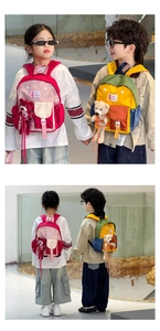 Detail of vibrant color-block kids backpack with cute plush animal charm and buckle strap