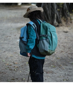 Detail of adjustable chest straps and side mesh pockets on a blue outdoor kids backpack