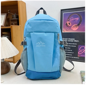 Detail of blue outdoor backpack with mountain print and durable mesh side pockets