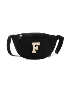 Detail of black kids chest bag with chenille letter F and white plastic buckle clip