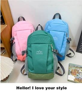 Outdoor backpacks in pink, green and blue featuring side mesh pockets and mountain logo