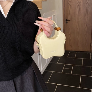 Cute star-shaped cream yellow kids handbag with vintage wooden bead handle design