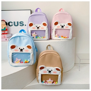Detail view of cartoon backpacks with transparent bear pockets and colorful star fillings
