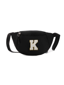 Close-up of black nylon kids chest bag featuring a white towel-embroidered K letter