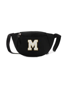 Detailed view of black nylon kids chest bag featuring a white embroidered letter M patch