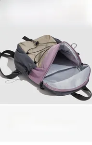 Spacious interior view of the nylon hiking backpack with organized storage compartments