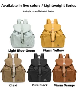 Detailed flat lay of high-capacity minimalist nylon backpacks in five assorted colors
