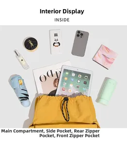 Flat lay of yellow drawstring backpack showing large capacity and internal compartments