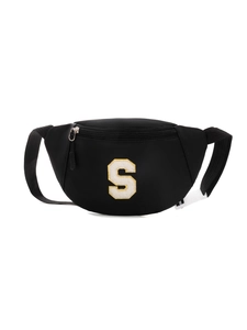 Detail of black nylon kids chest bag featuring a fuzzy letter S embroidery patch