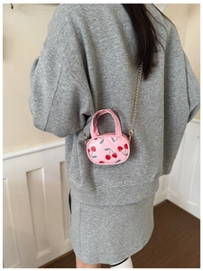 Pink mini crossbody bag with cherry print and golden chain strap for girls