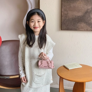 Pink cylinder handbag for kids with twin handles and adjustable metal buckle details
