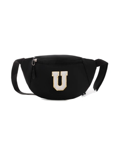 Detail of black crossbody bag featuring a large embroidered letter U with golden borders