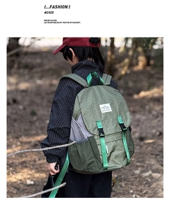 Detail of checkered plaid outdoor backpack with buckle closure and mountain logo