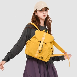 Side view of a bright yellow tear-resistant nylon backpack with side water bottle pocket