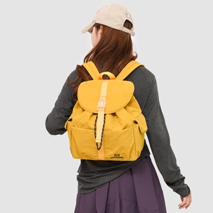 Minimalist bright yellow children's backpack with waterproof fabric and buckle closure