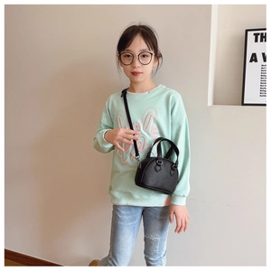 Mini black shell-shaped handbag with litchi texture and adjustable shoulder strap for kids