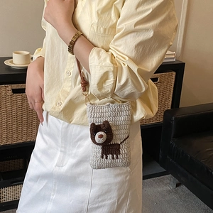 Handmade crochet shoulder bag for kids featuring a cute beige puppy design with brown strap