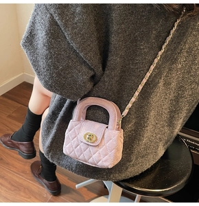 Detail of pink quilted velvet mini bag for girls with chain strap and interlocking clasp