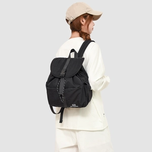 Side view of black water-resistant nylon backpack with adjustable buckle and side pockets