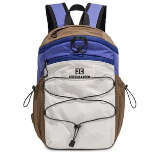 Outdoor hiking backpack with blue and brown nylon panels and front elastic storage cord