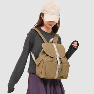 Side view of khaki waterproof nylon backpack with white woven strap and buckle details