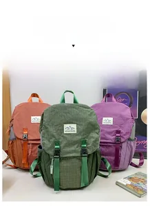 Three colors of durable grid fabric children's hiking backpacks with mountain logo detail