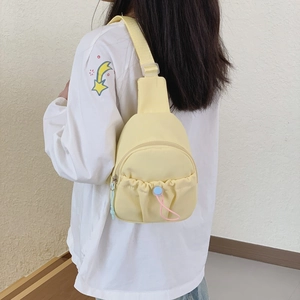 Minimalist light yellow nylon chest bag for kids with adjustable strap and drawstring