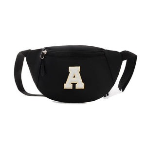 Black canvas chest bag for kids featuring a large sequined letter A patch and buckle strap