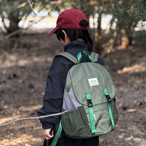 Outdoor children hiking backpack with green checkered pattern and mountain logo