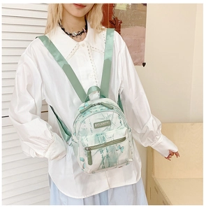 Detail of kids backpack featuring elegant green bamboo and butterfly print on canvas